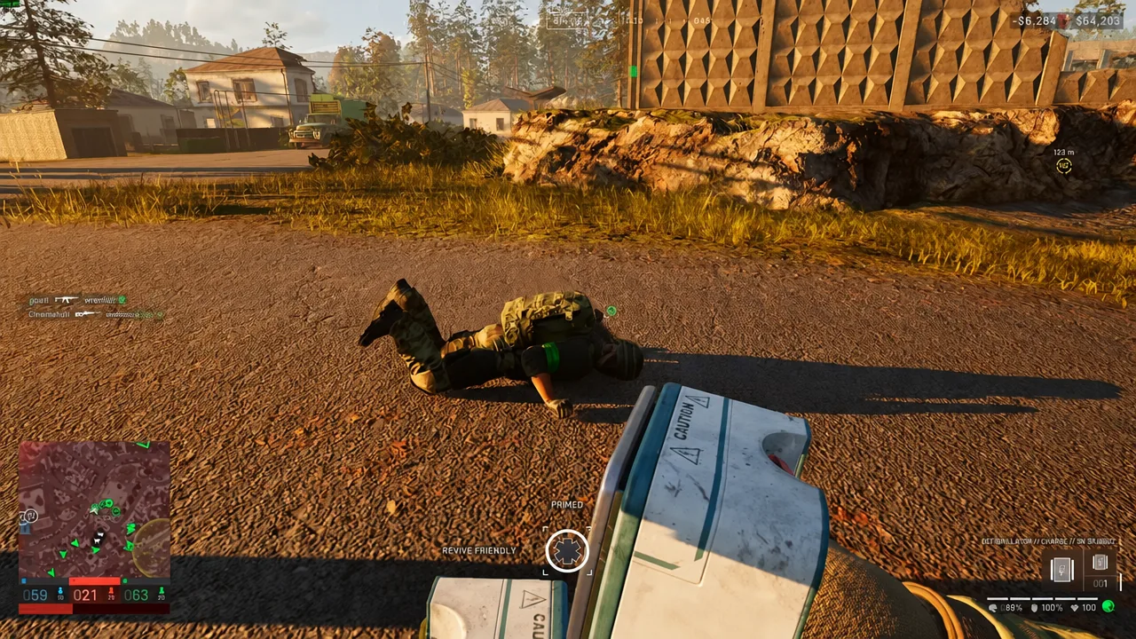 The REVIVE FRIENDLY prompt over a downed friendly as a primed medical device is used