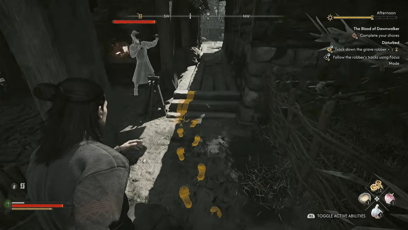 Focus Mode lighting up the grave robber's yellow footprints along a ruined stone wall