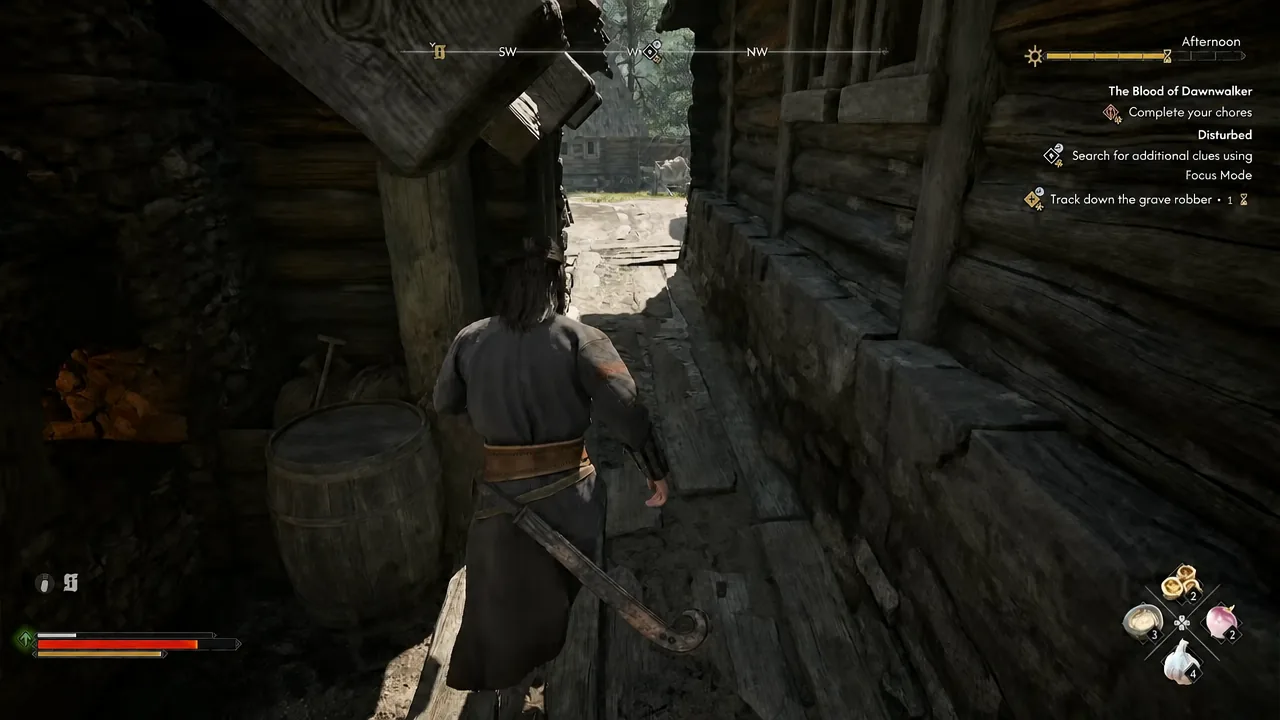 The Track down the grave robber objective on screen as Coen moves through a narrow wooden passage