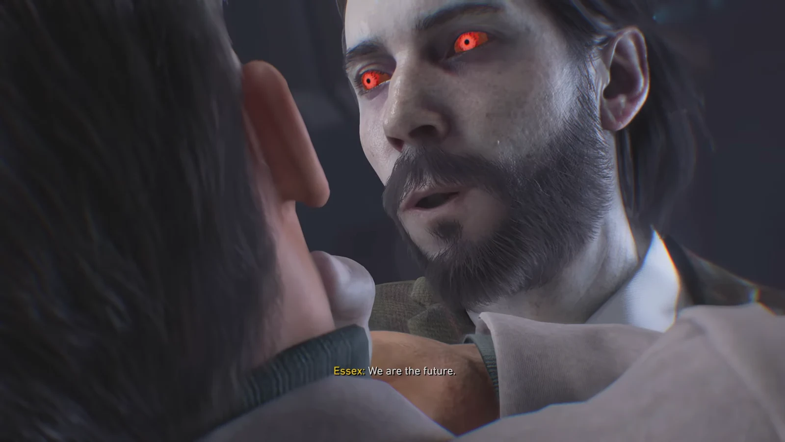 Pale, red-eyed Essex speaking the line We are the future during the cutscene
