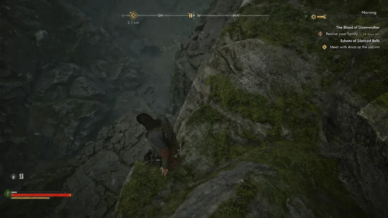 Coen climbing down the rocky cliff face of the ravine toward the compass objective