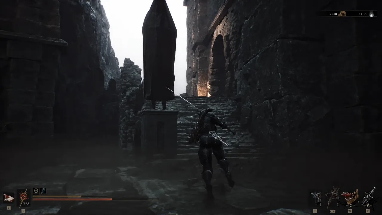 Player climbing the tomb stairs toward an enemy on the level with the breakable wall