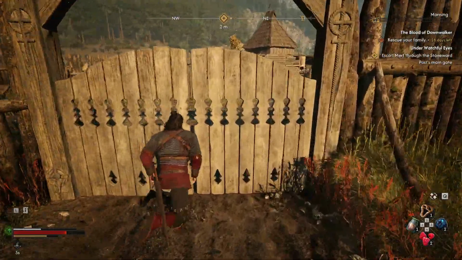 Coen approaching a wooden gate inside Stoneward Post with the escort objective active