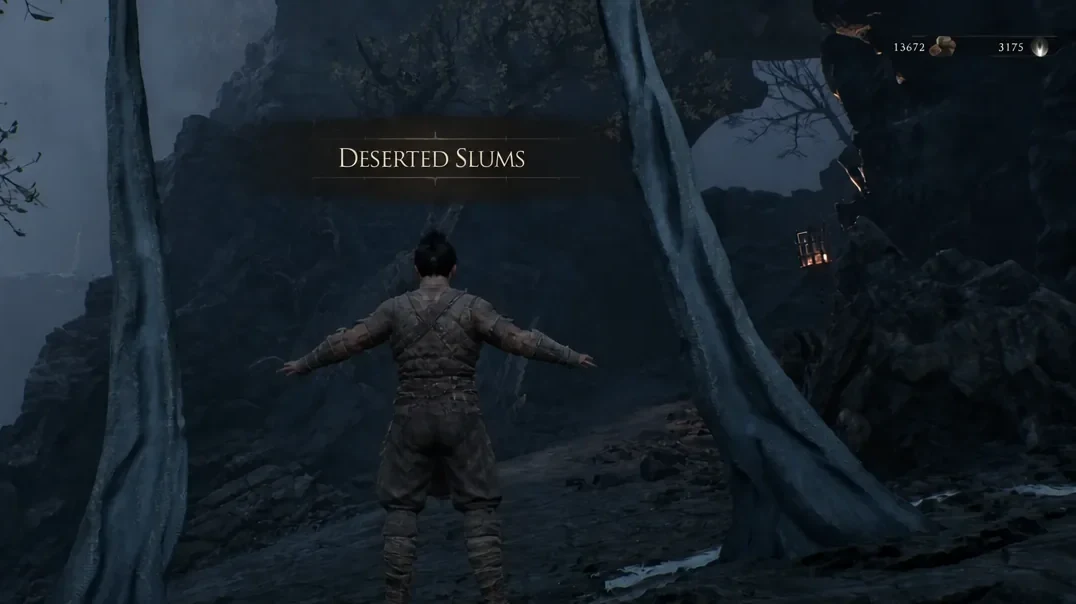 The Deserted Slums area name appearing on screen as the player enters the region