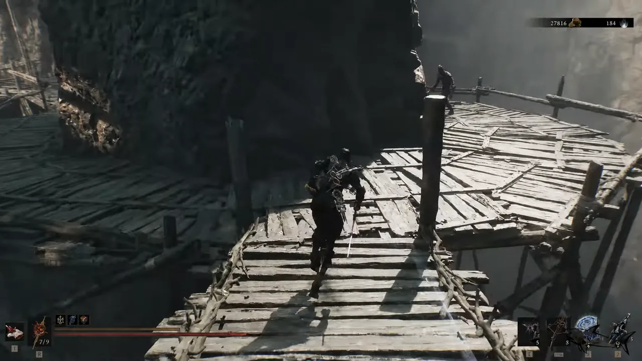 Player crossing a wooden scaffolding bridge toward the platform at the stone pillars