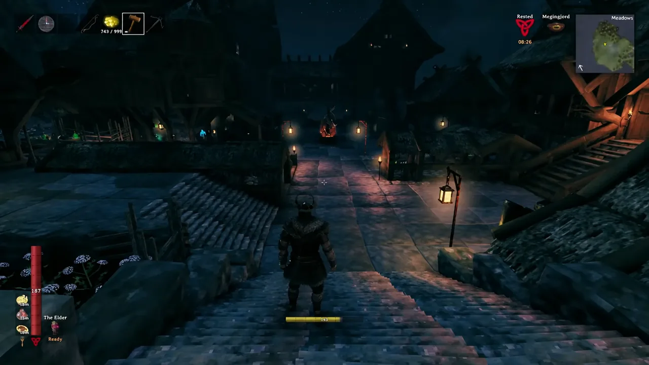 Viking walking down a stone staircase through a torch-lit village on the way to the trader