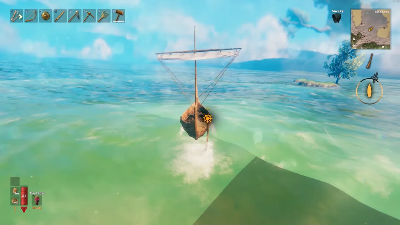 Player at the helm of a sailing boat crossing open water off a Meadows coastline