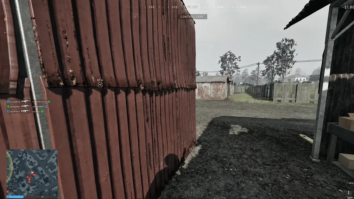 Control Zone marker showing 67 meters as a player moves past a shipping container toward the capture area