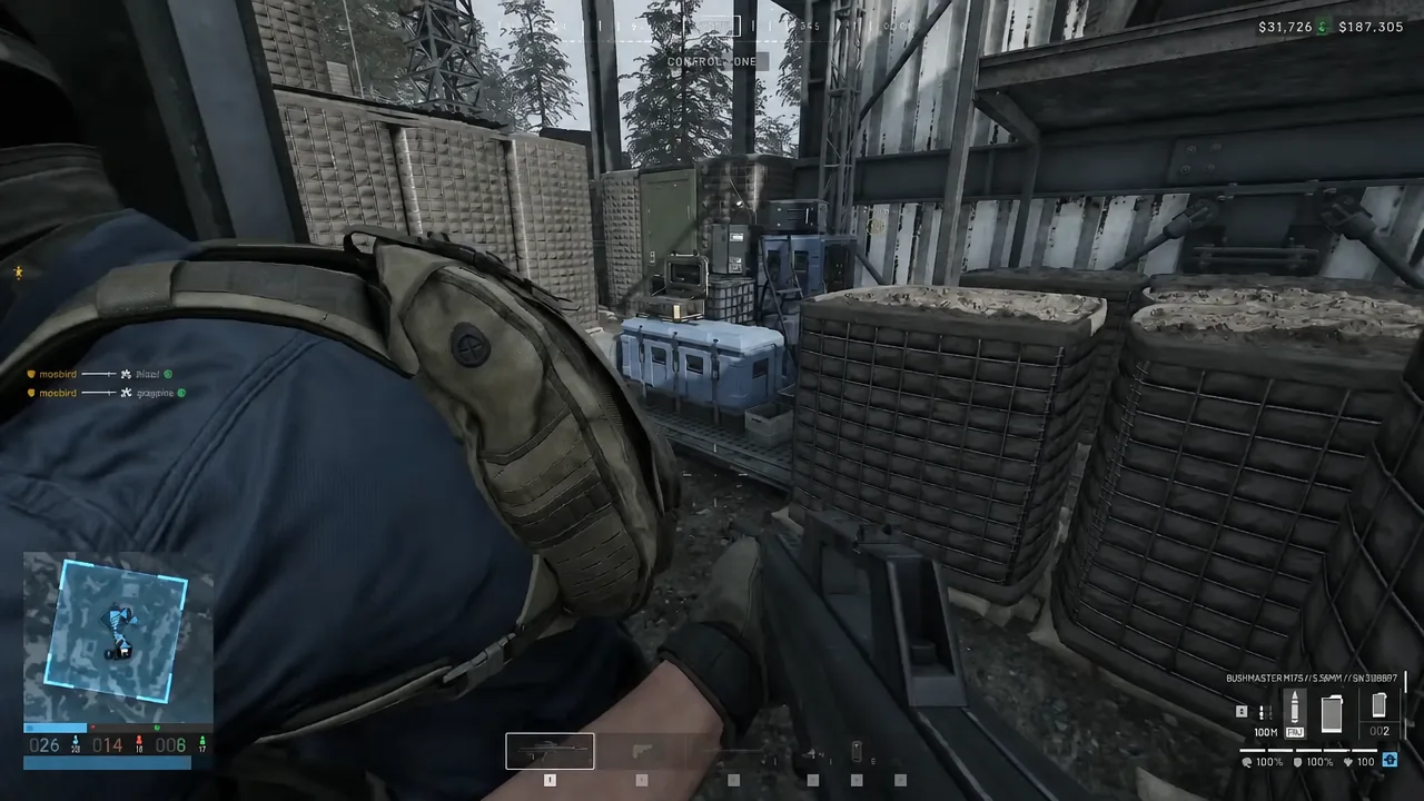 WARDOGS gameplay with the objective and score HUD visible during a contested zone fight