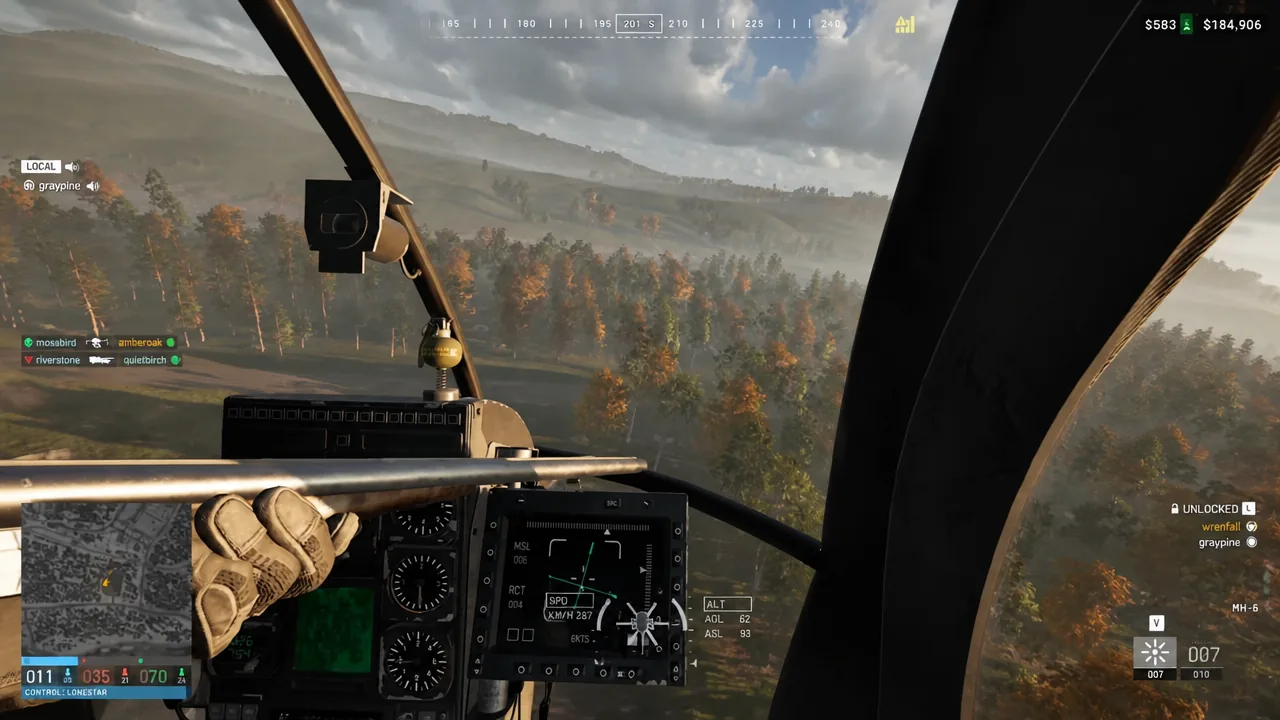 Cockpit view of an MH-6 in flight with the WARDOGS flight instruments and vehicle status on screen