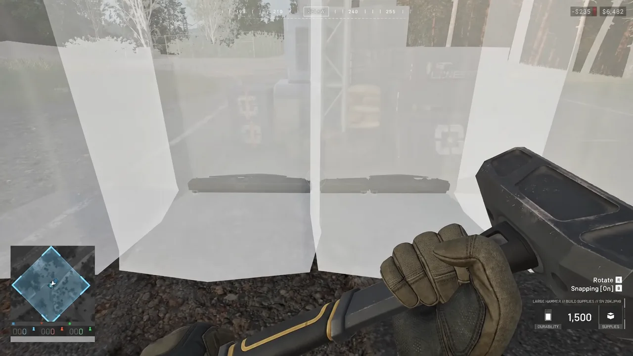 Build placement view with the Build Supplies counter and Rotate and Snapping key prompts on screen