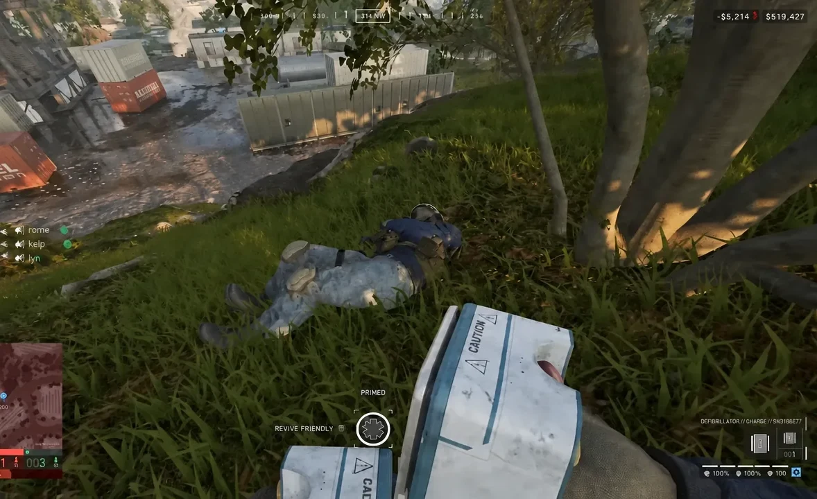 Revive prompt showing REVIVE FRIENDLY and PRIMED while using a defibrillator on a downed teammate