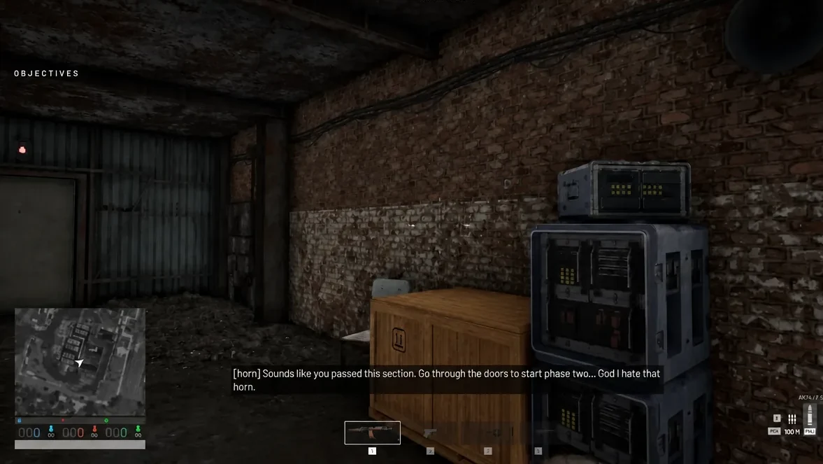 Objectives list on screen as the player crosses an industrial room toward the doors for phase two