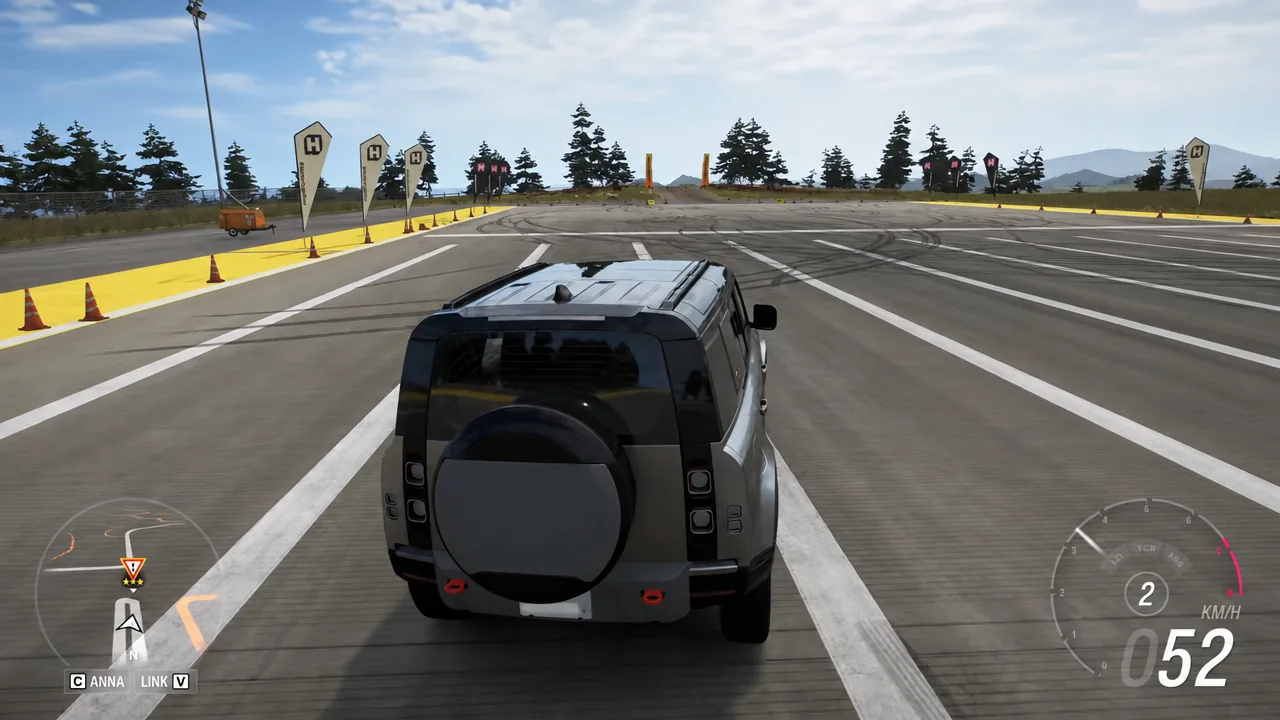 Driving HUD showing the SUV accelerating in second gear along a marked track