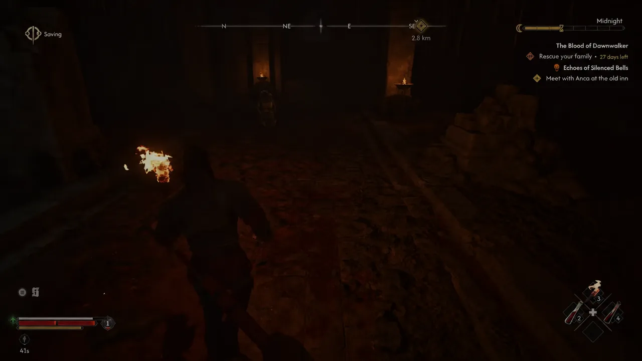 Coen walks through a torch-lit dungeon corridor toward a quest marker to the southeast