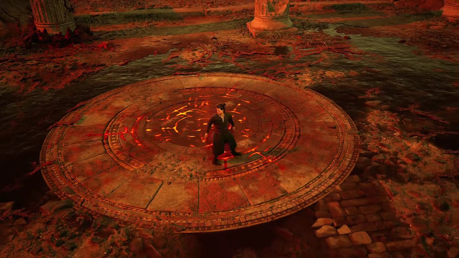Coen stands in a ruined red-lit landscape as the new region notification appears