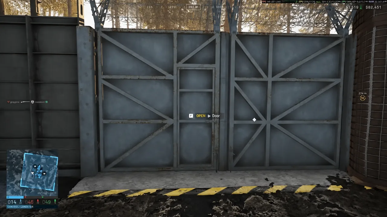 On-screen F key prompt reading OPEN Door in front of a metal gate