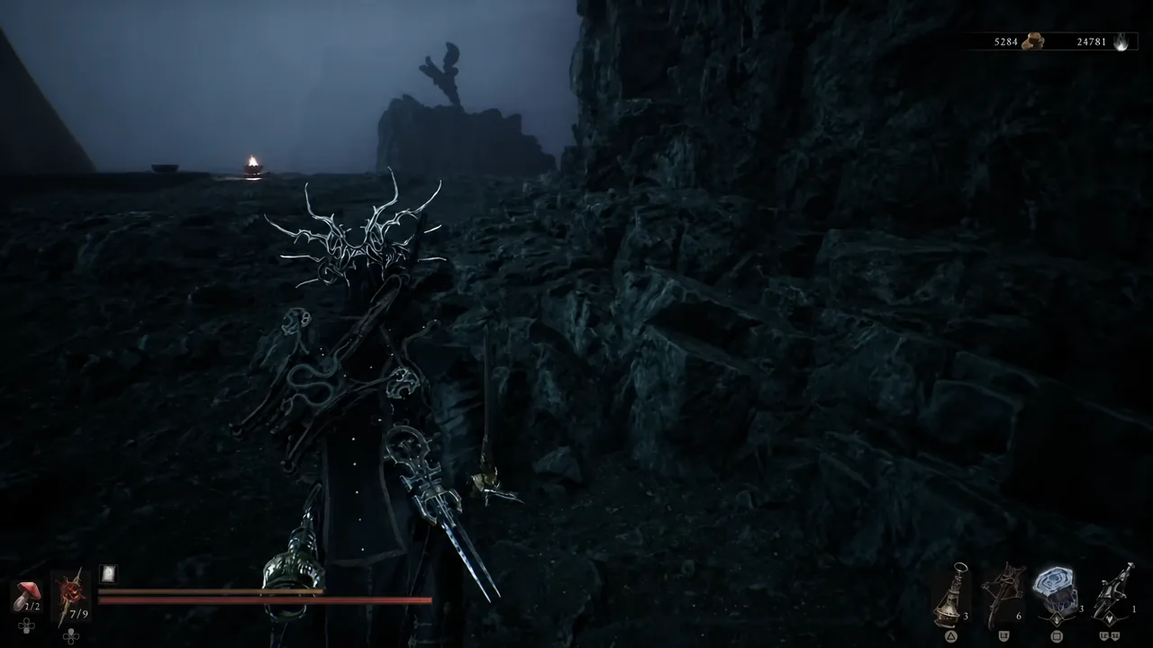 The player exploring a dark rocky cavern with weapons drawn and the status HUD visible
