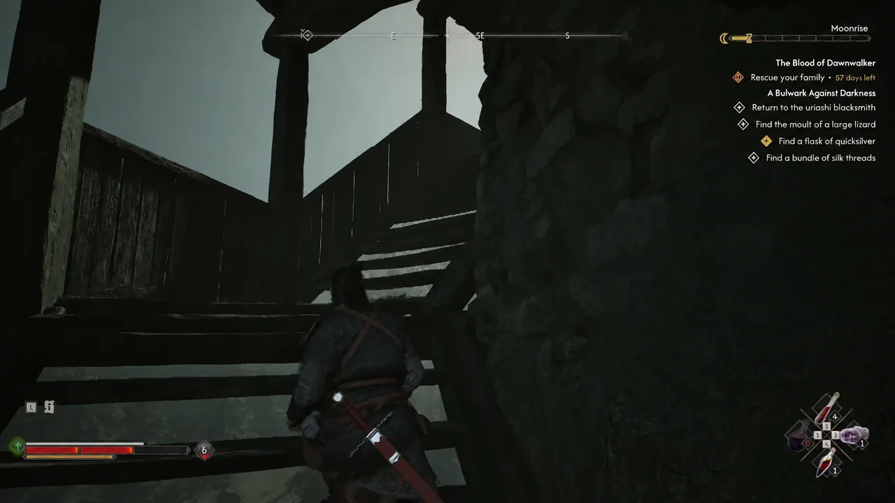 Climbing the final wooden staircase to the top room of Silts Tower