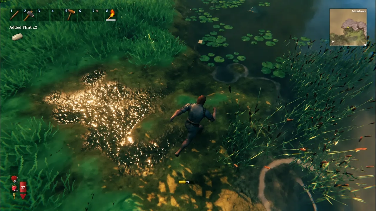 Player wading through shallow water as an Added Flint x2 pickup notification appears