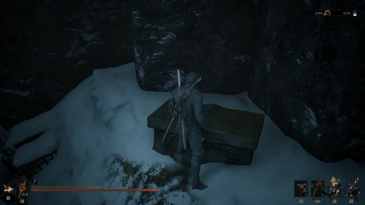 Opening the chest freed by a stone hand statue in an icy cavern in Mornefrost Grave
