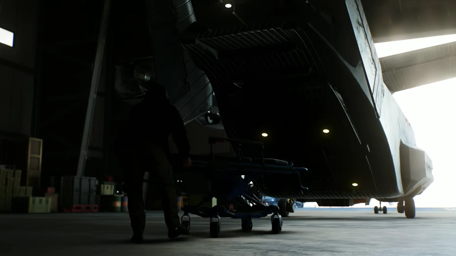 Logan and Mystique help an injured Callisto onto a stretcher as the rescued mutants leave the ship in the hangar