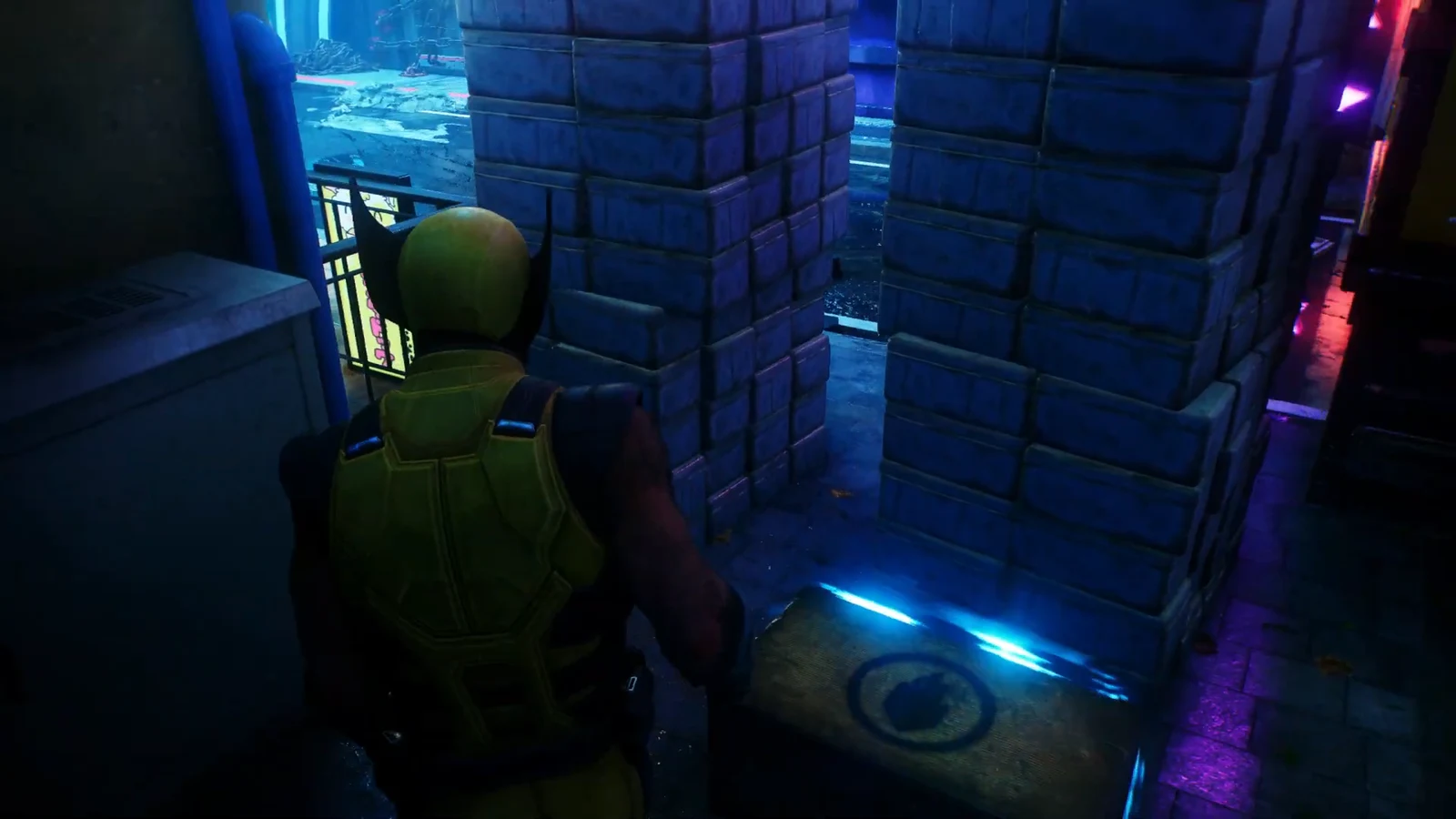 Logan approaches a glowing blue marker on the ground between brick pillars in wrecked Shinjuku