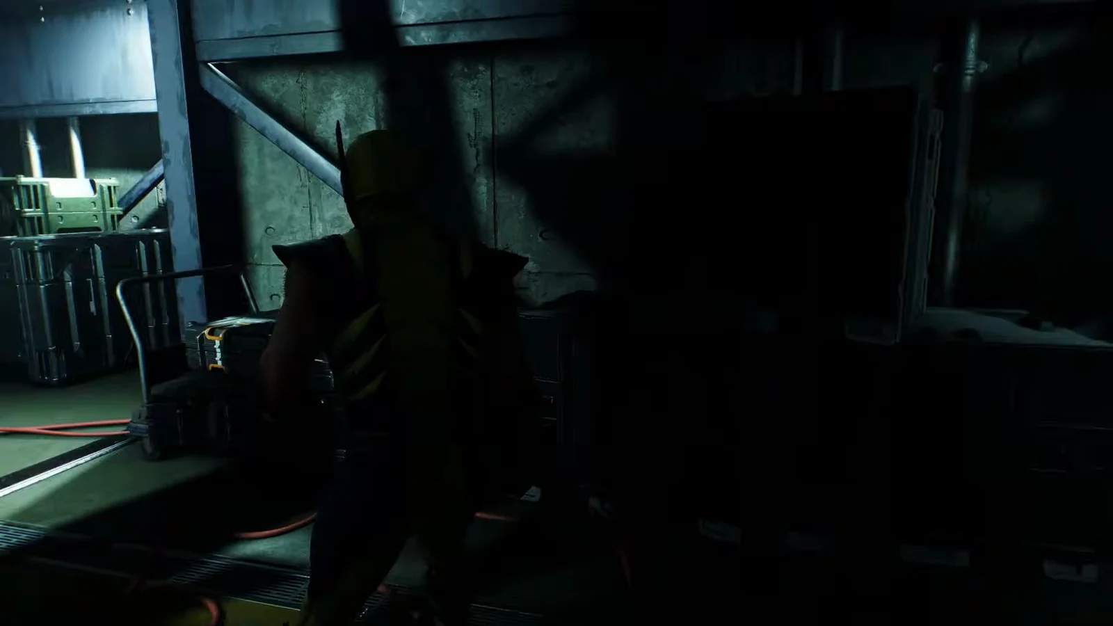 Logan moves through the lower levels of the Trask Industries facility in Madripoor