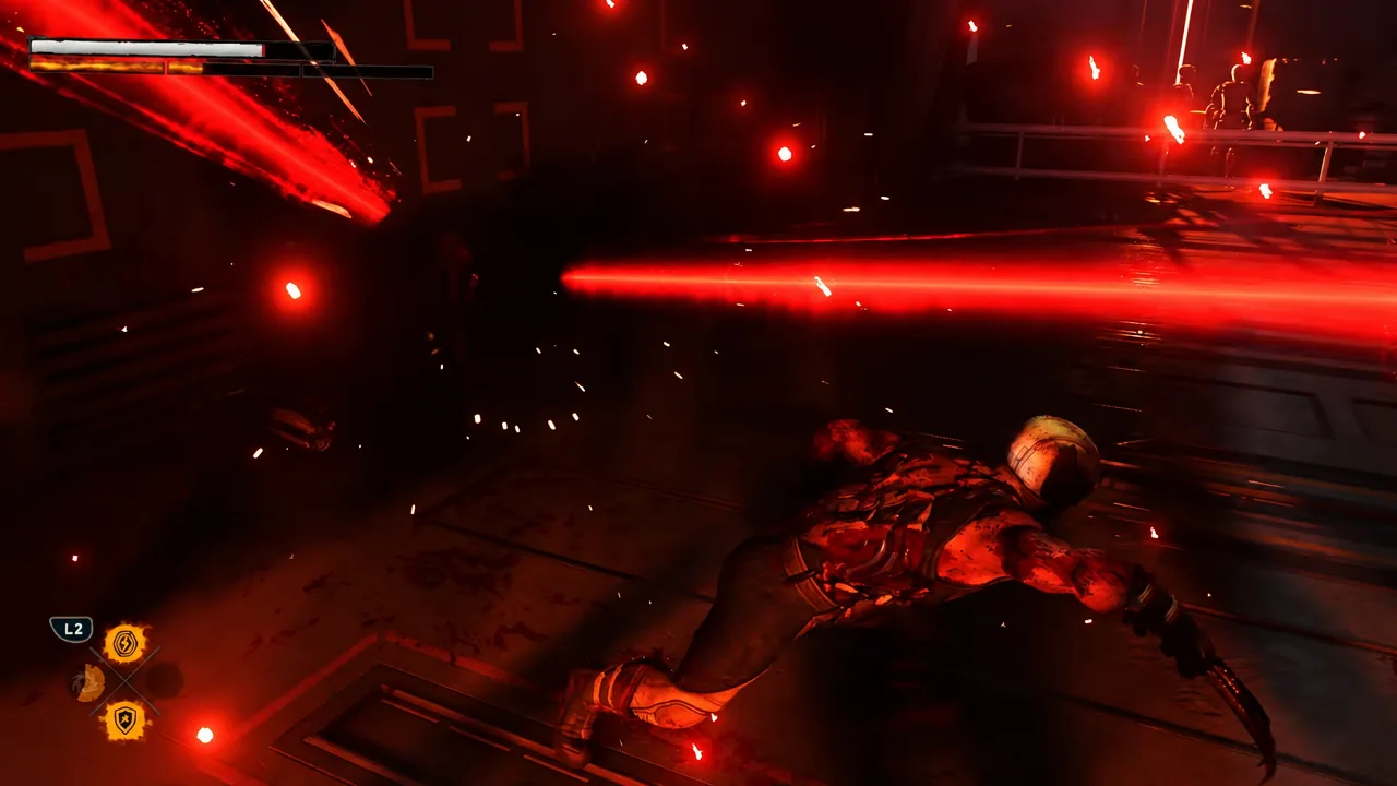 Gameplay HUD showing the L2 ability prompt as red laser beams sweep across an armored enemy