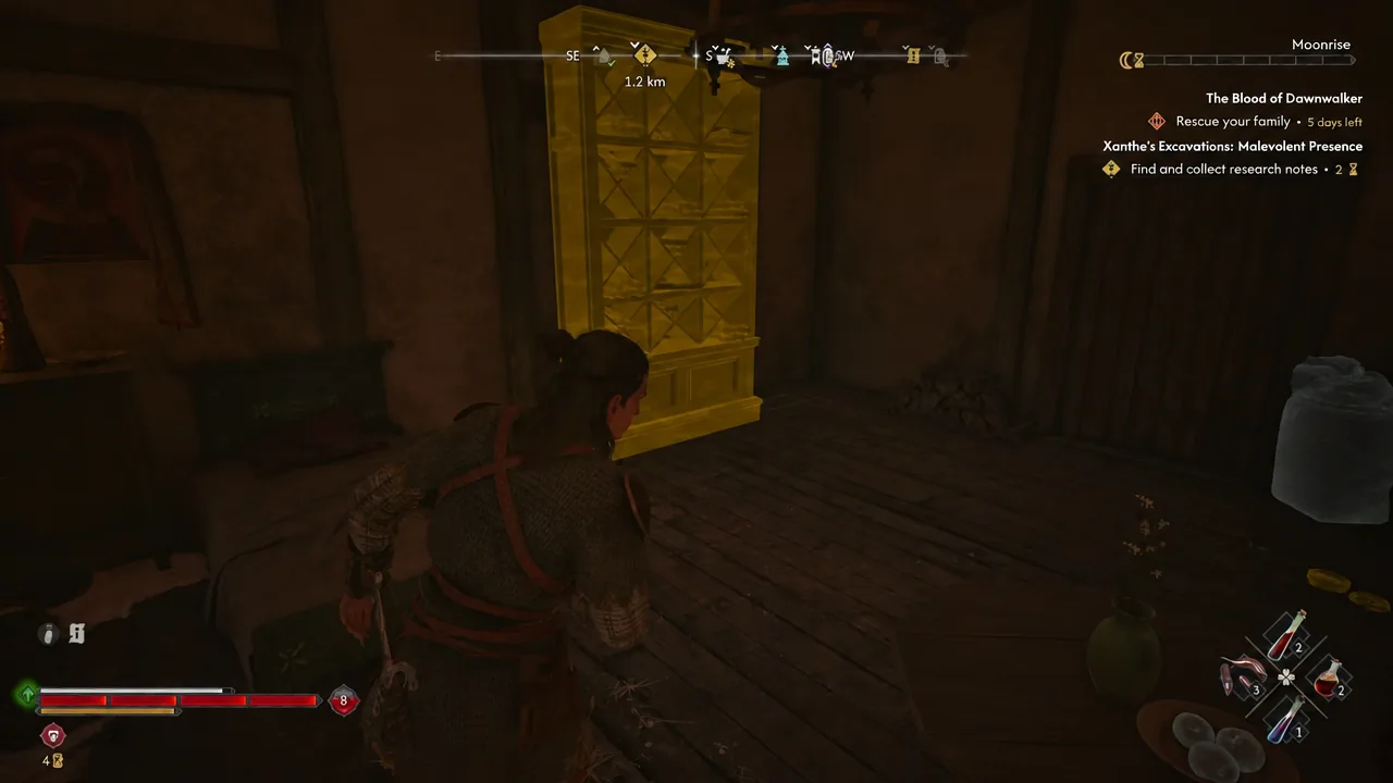 Coen stands on the balcony facing the glowing attic door of the Curious House at night