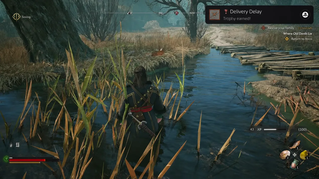 Gameplay HUD showing the Return to Anca objective as Coen wades toward a plank bridge