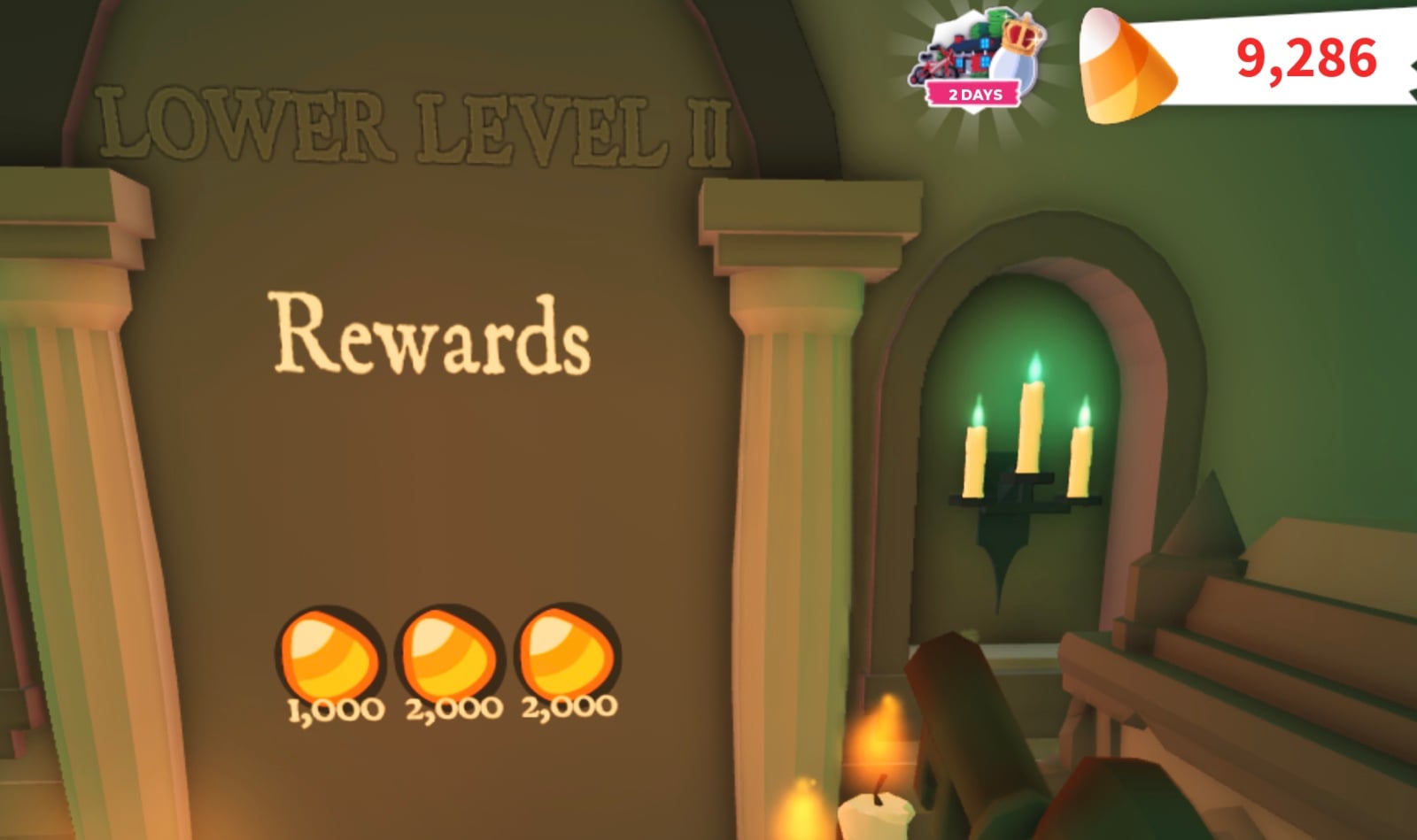 LOWER LEVEL II sign and Rewards plaque in the Adopt Me Crypt showing three Candy Corn rewards: 1,000, 2,000 and 2,000