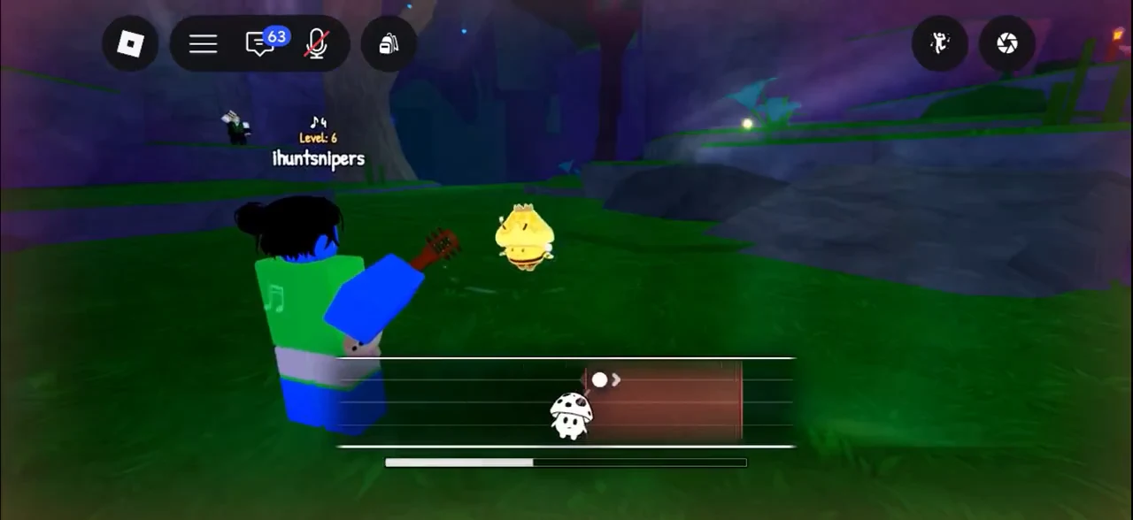 Playing the guitar toward a yellow scroom as the bottom timing bar fills
