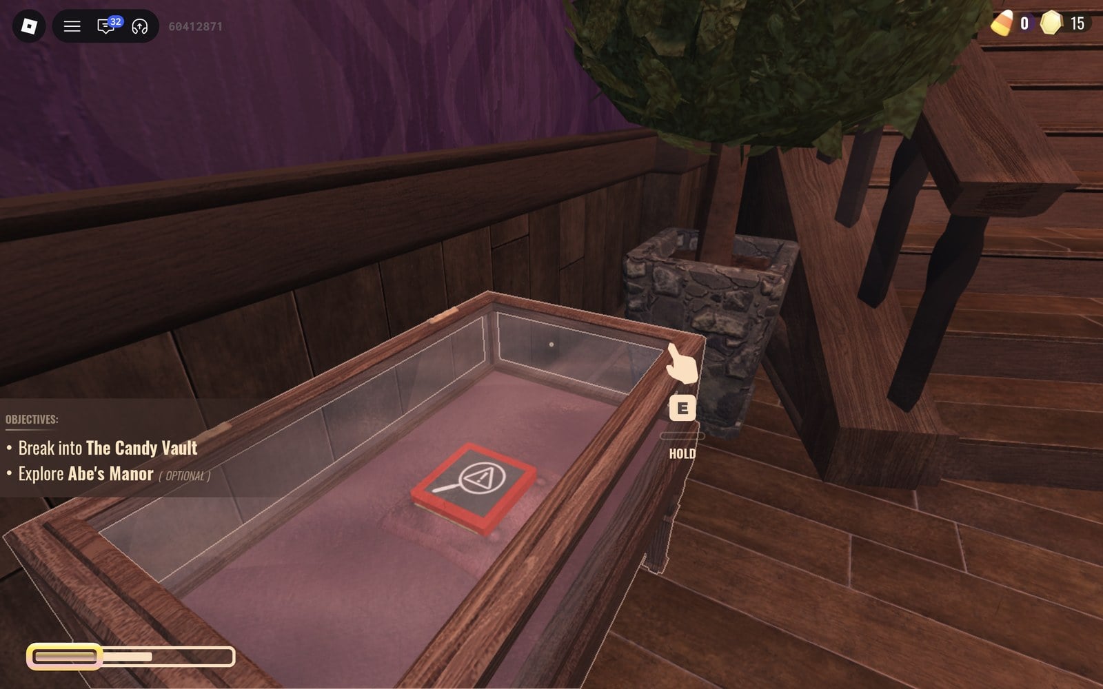Glass case at the foot of the foyer stairs holding a red book, with an E and HOLD prompt, in DOORS