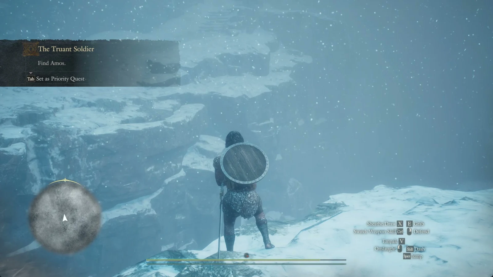 Character with round shield on snowy cliff edge in blizzard, quest panel and minimap visible, control prompts at lower right.