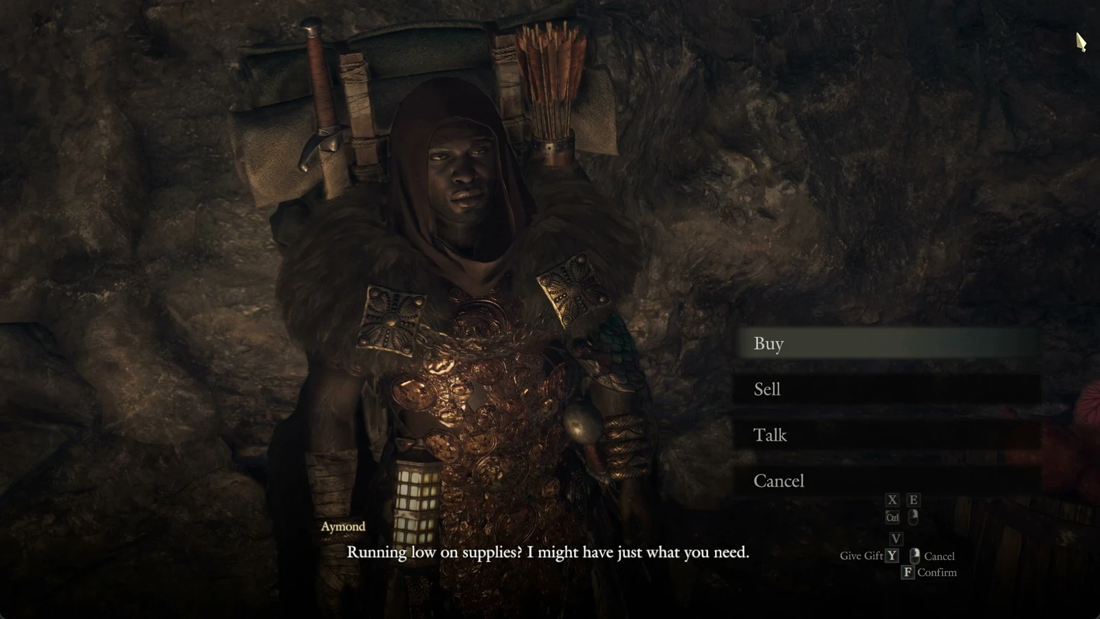 Hooded merchant in coin armour in a cave with a dialogue line and a menu offering Buy, Sell, Talk and Cancel.