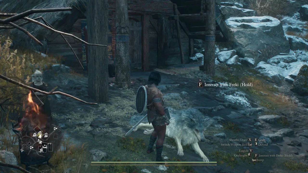 Interact with Freki hold prompt beside the wolf at the camp