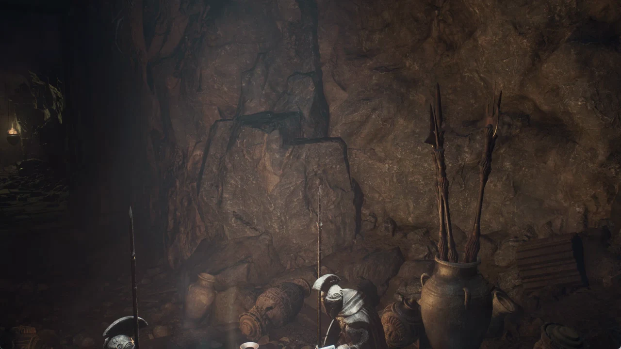 Armored character crouches among pottery and spears to collect an item from the ground