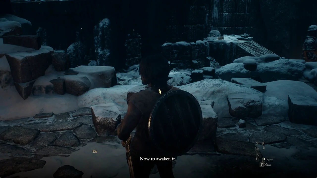 Eir saying Now to awaken it at the statue with the Next prompt visible in the snowy ruins