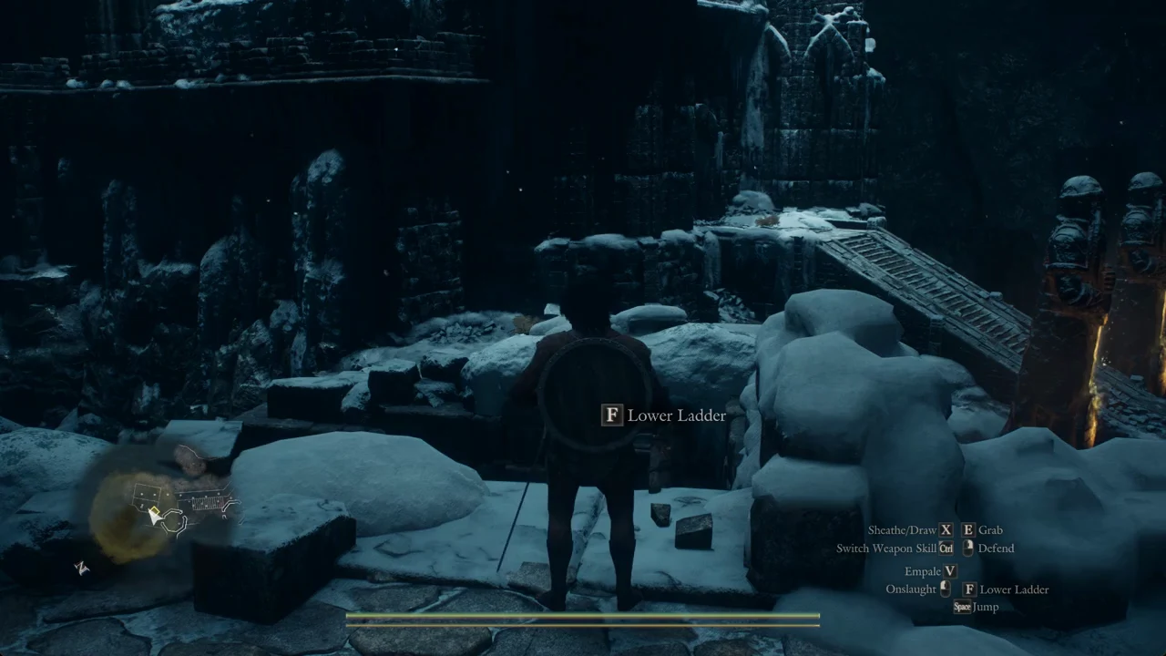 The F Lower Ladder prompt displayed at the edge of the wall in the snowy ruins