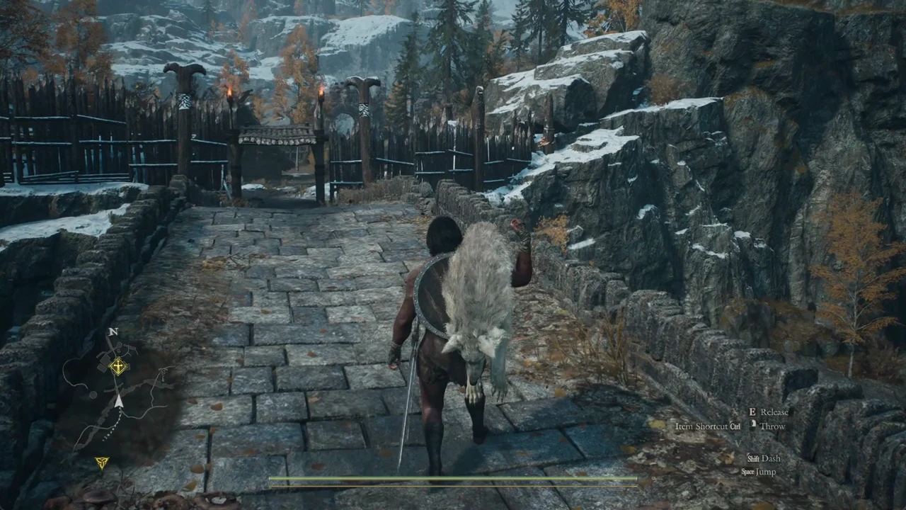 Character carrying a creature toward a settlement gate with Release and Throw prompts