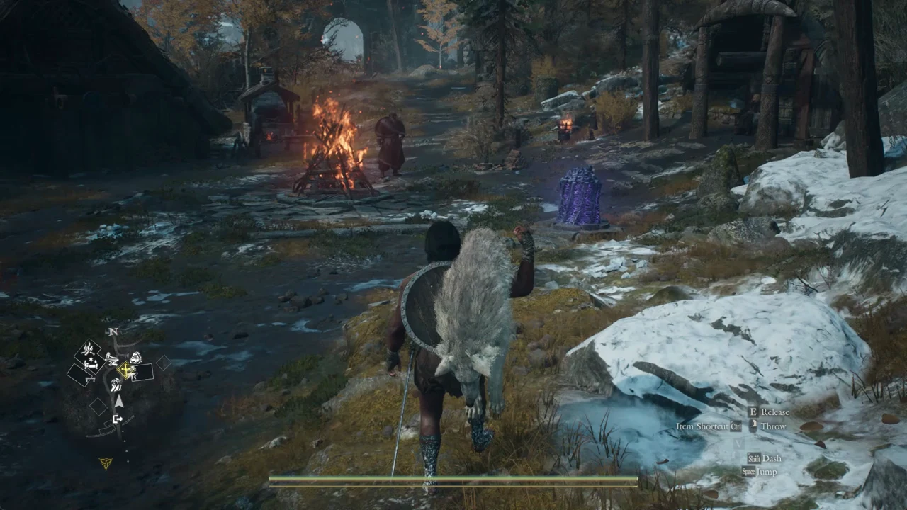 Character holding a load near a glowing purple object inside the camp