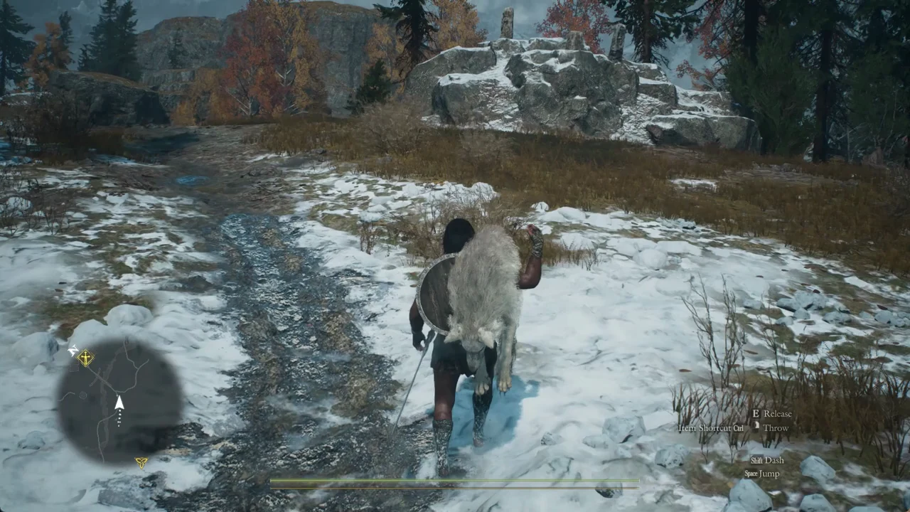 Character carrying a creature over one shoulder on a snowy path