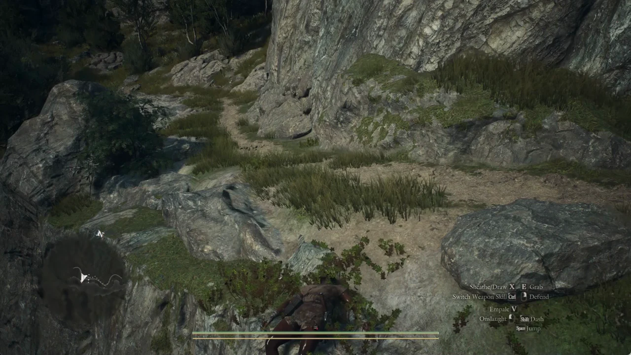 The Arisen climbing a rocky ledge beside a narrow mountain path above the waterfall pool