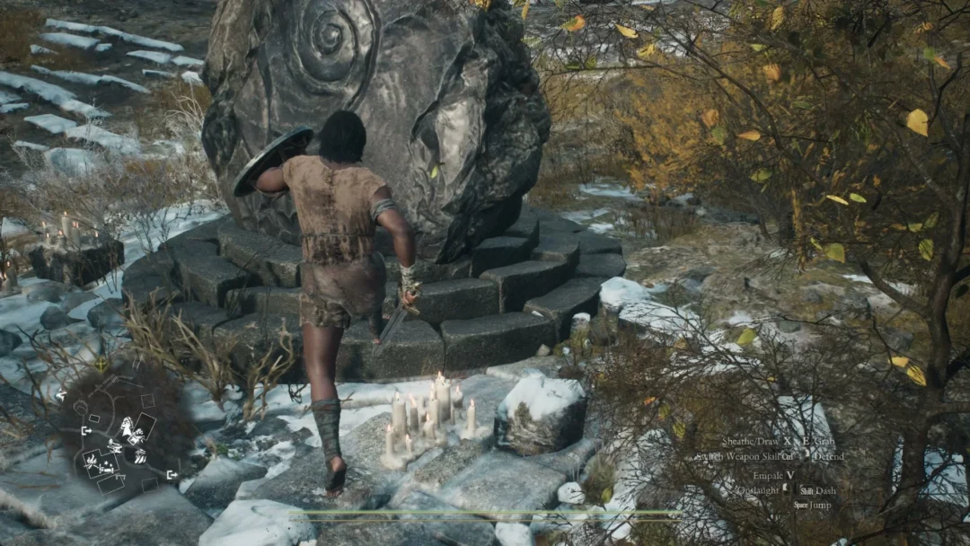 The Arisen walking up to the Grand Riftstone of Norgan, a tall boulder carved with a spiral on a ring of stone steps