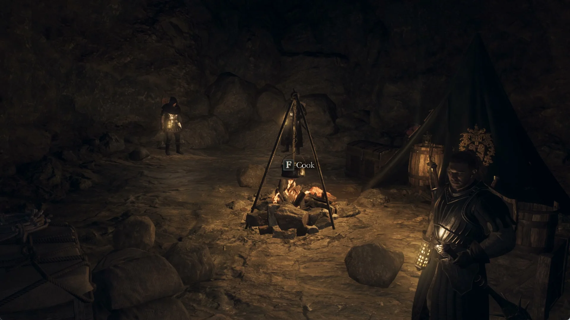 A campfire with a cooking tripod and a Cook prompt inside the cave of Northwall Campground, soldiers standing nearby