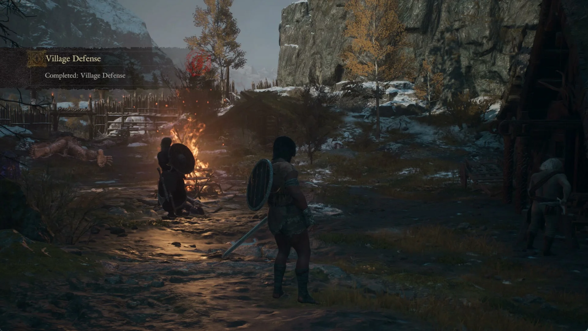 Banner Completed: Village Defense at first light by the settlement bonfire, with a pale beast lying dead beyond it