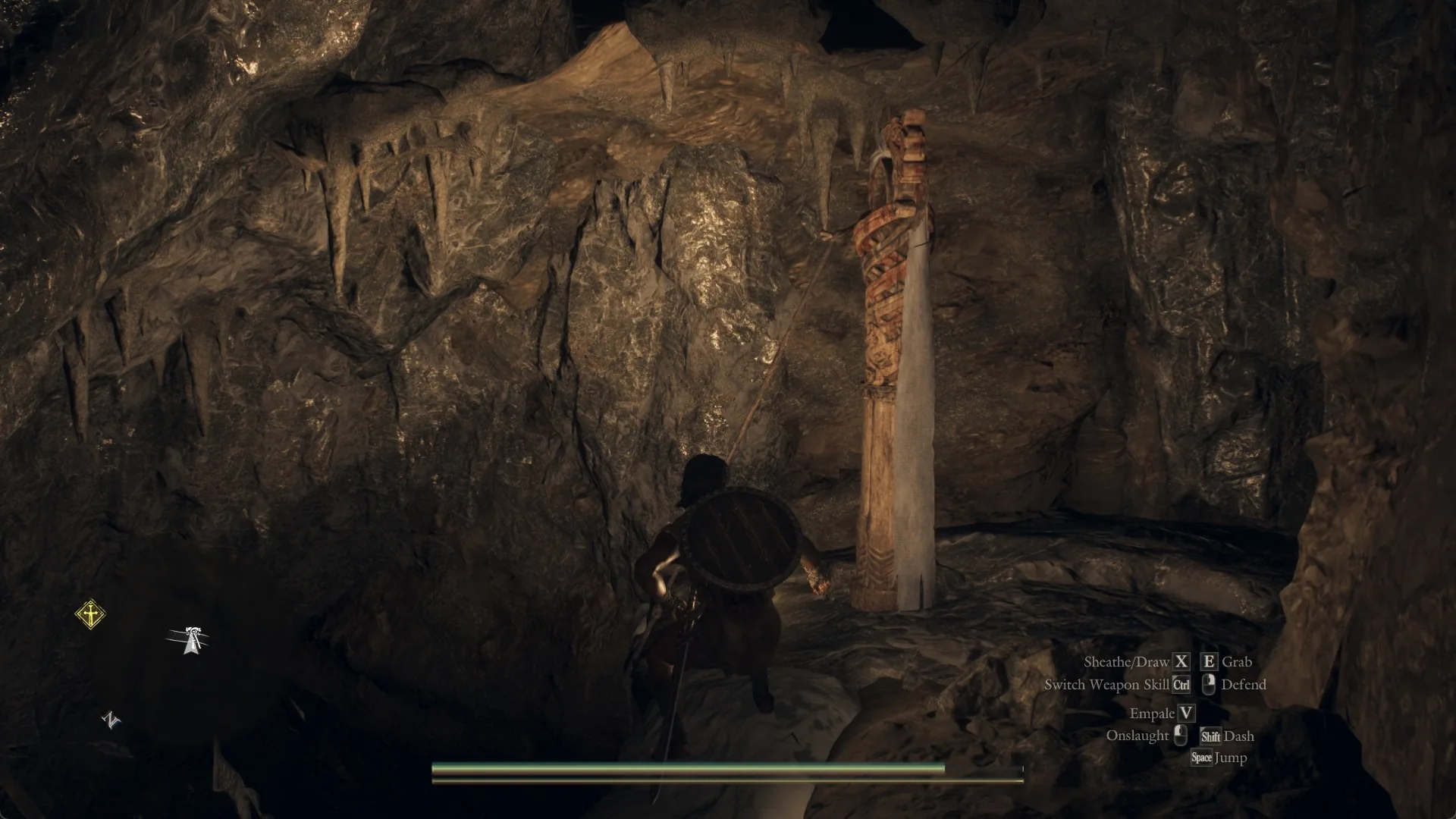 The Arisen with a lit lantern stands before the carved Hook Tether Post in a round rock hollow, a rope tied near its top