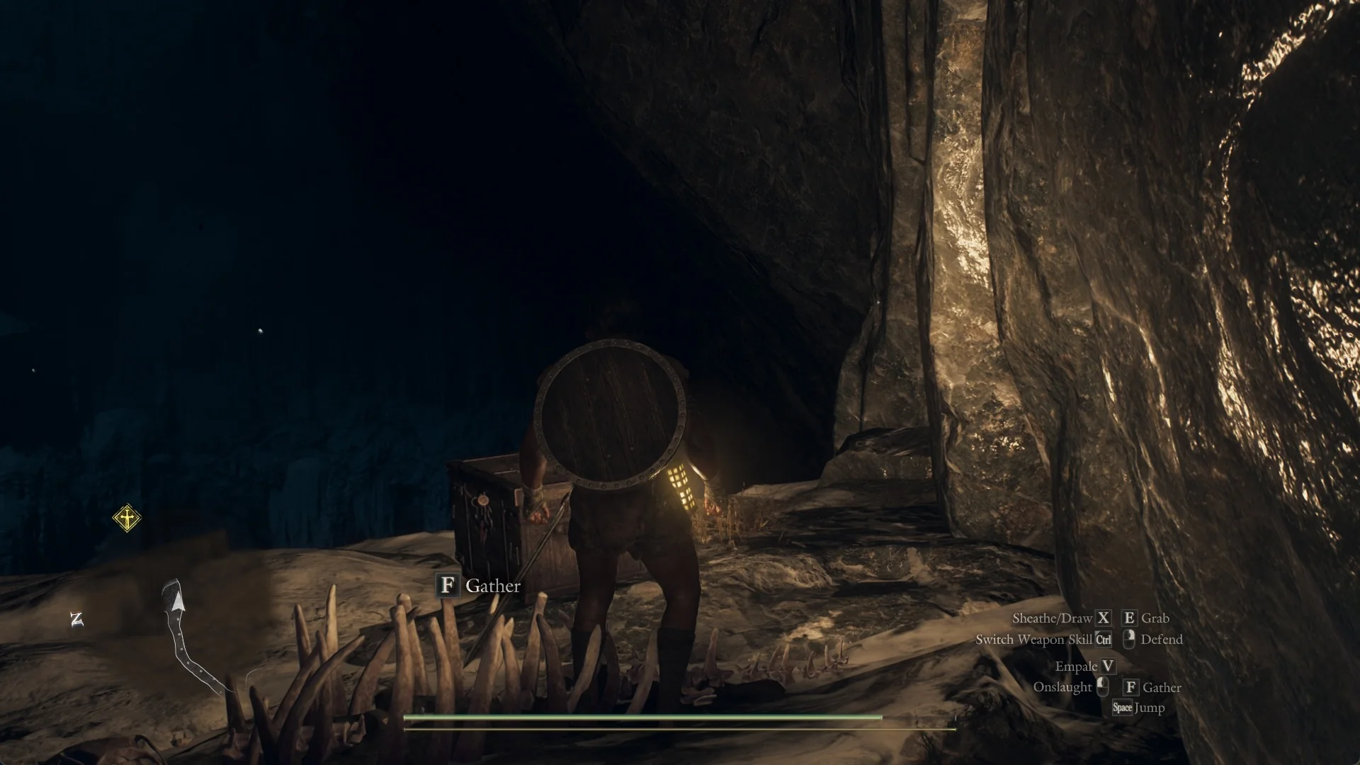 The Arisen on a dark ledge beside a pile of bones with a Gather prompt and an iron-bound chest