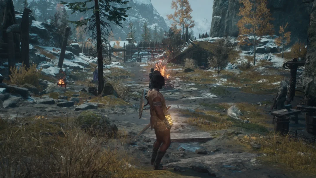 The Arisen with a lit lantern on a path through the Norgandian Settlement